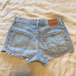 Levi’s 501 distressed frayed mini jean shorts